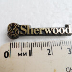 Genuine original Sherwood separates plastic badge logo 2 pins intact | p/n 5637 21003 101 OS